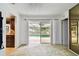 Living room with sliding glass doors leading to the pool area at 117 Hillcrest Dr, Bradenton, FL 34209