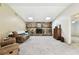 Living room features a stone fireplace and vaulted ceilings at 117 Hillcrest Dr, Bradenton, FL 34209