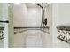 Walk-in shower with tiled walls and built-in seat at 117 Hillcrest Dr, Bradenton, FL 34209