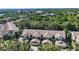 Aerial view showcasing a cluster of condos nestled in a green landscape at 1676 Starling Dr # 202, Sarasota, FL 34231