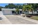 Newly renovated home with a spacious driveway and palm trees at 1809 Southwood St, Sarasota, FL 34231