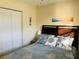 Bedroom with double bed, coastal decor and white closet doors at 2549 Arapaho St, Sarasota, FL 34231