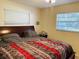 Main bedroom with double bed, ceiling fan and window blinds at 2549 Arapaho St, Sarasota, FL 34231