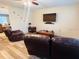 Living area with brown leather recliners and a flat-screen TV at 2549 Arapaho St, Sarasota, FL 34231