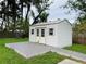 Spacious storage shed in backyard with gray deck at 2549 Arapaho St, Sarasota, FL 34231