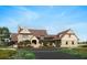 Impressive estate home's exterior showcasing stonework and a charming front entrance at 32108 Grand National Dr, Myakka City, FL 34251