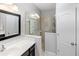 Bathroom with a walk-in shower and single vanity at 5450 Fairfield Blvd, Bradenton, FL 34203