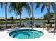 Relaxing hot tub with palm trees and lake view at 5450 Fairfield Blvd, Bradenton, FL 34203