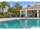 Resort-style community pool with lounge chairs and a patio at 5450 Fairfield Blvd, Bradenton, FL 34203