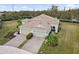 Two-story house with tile roof and two-car garage, nicely landscaped at 5450 Fairfield Blvd, Bradenton, FL 34203