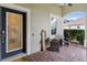 Inviting front porch with seating area and decorative welcome sign at 5450 Fairfield Blvd, Bradenton, FL 34203