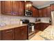 Well-equipped kitchen with stainless steel appliances and granite countertops at 5450 Fairfield Blvd, Bradenton, FL 34203