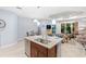 Kitchen island with granite countertop and stainless steel sink at 5450 Fairfield Blvd, Bradenton, FL 34203