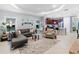 Living room with sectional sofa and views into kitchen and dining area at 5450 Fairfield Blvd, Bradenton, FL 34203