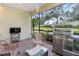 Relaxing screened lanai with outdoor seating and grill at 5450 Fairfield Blvd, Bradenton, FL 34203