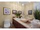 Elegant powder room with unique vessel sink and decorative tile at 8480 Big Buck Ln, Sarasota, FL 34240