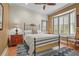 Spacious bedroom with a metal bed frame and window seat at 8480 Big Buck Ln, Sarasota, FL 34240