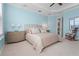 Bright bedroom with plush bedding and plenty of natural light at 8480 Big Buck Ln, Sarasota, FL 34240