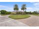 Stunning curb appeal with palm trees and brick driveway at 8480 Big Buck Ln, Sarasota, FL 34240