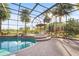 Inviting screened pool with spa and brick patio at 8480 Big Buck Ln, Sarasota, FL 34240