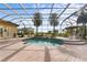 Inviting screened pool with spa and brick patio at 8480 Big Buck Ln, Sarasota, FL 34240