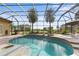 Inviting screened pool with spa and brick patio at 8480 Big Buck Ln, Sarasota, FL 34240