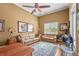 Bright sitting room with two sofas and a large window at 8480 Big Buck Ln, Sarasota, FL 34240