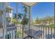 Relax on this screened patio with a view of a palm tree and street parking at 4802 51St W St # 908, Bradenton, FL 34210