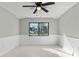 Bright bedroom with window and wainscoting at 5310 26Th W St # 2703, Bradenton, FL 34207