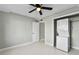 Bedroom with ceiling fan and stackable washer/dryer at 5310 26Th W St # 2703, Bradenton, FL 34207