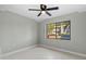 Bright bedroom with ceiling fan and window view at 5310 26Th W St # 2703, Bradenton, FL 34207