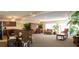 Spacious community room with seating area, dining table, and kitchen at 5310 26Th W St # 2703, Bradenton, FL 34207