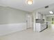 Entryway with white door and adjacent kitchen view at 5310 26Th W St # 2703, Bradenton, FL 34207