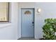 Light blue front door entrance to building, address number 2703 at 5310 26Th W St # 2703, Bradenton, FL 34207