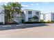 Condo building exterior with parking and landscaping at 5310 26Th W St # 2703, Bradenton, FL 34207