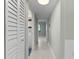 Hallway with tile floors and access to rooms at 5310 26Th W St # 2703, Bradenton, FL 34207