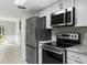 Modern kitchen with stainless steel appliances and granite counters at 5310 26Th W St # 2703, Bradenton, FL 34207