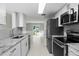Modern kitchen with stainless steel appliances and granite counters at 5310 26Th W St # 2703, Bradenton, FL 34207