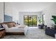 Bright bedroom with a king-size bed and access to a private patio at 1212 Center Pl, Sarasota, FL 34236