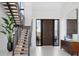 Bright and spacious entryway with modern staircase and large front door at 1212 Center Pl, Sarasota, FL 34236