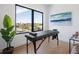 Home office with large window and modern desk setup at 1212 Center Pl, Sarasota, FL 34236