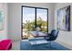 Modern home office with large window and blue chair at 1212 Center Pl, Sarasota, FL 34236