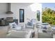 Outdoor kitchen and seating area with pool views at 1212 Center Pl, Sarasota, FL 34236