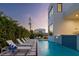 Tranquil pool area with lounge chairs at dusk at 1212 Center Pl, Sarasota, FL 34236