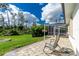 Relaxing backyard patio with firepit and grassy area at 2629 Rolling Rd, North Port, FL 34288