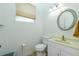 Simple bathroom with toilet, sink, and vanity at 2629 Rolling Rd, North Port, FL 34288