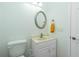 Small bathroom with toilet and sink at 2629 Rolling Rd, North Port, FL 34288