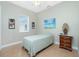 Small bedroom with a single bed and wood dresser at 2629 Rolling Rd, North Port, FL 34288