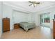 Bedroom with backyard access and tiled floors at 2629 Rolling Rd, North Port, FL 34288