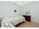 Bedroom with double bed, dresser, and tiled floor at 2629 Rolling Rd, North Port, FL 34288